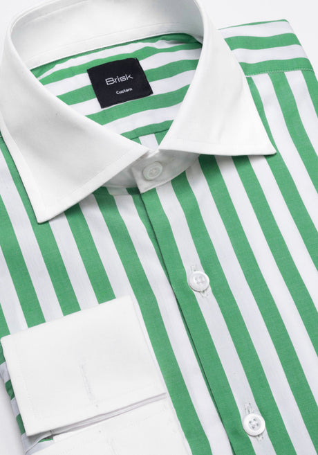 A close-up of a green and white striped dress shirt with a white collar and white buttons. The brand label inside the collar reads 'Brisk London'.